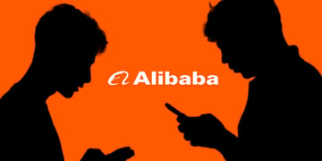 Two individuals looking at their smartphones with Alibaba logo in the background