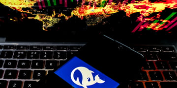 deepseek logo, white whale in blue background, black phone screen, black keyboard, world map