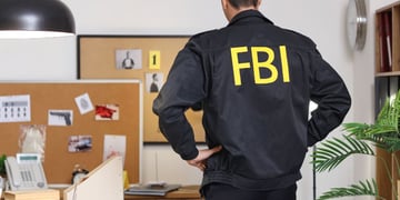 Male FBI agent in office, back view