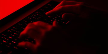 fingers on a laptop keyboard