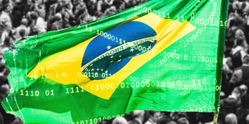 Brazilian flag with people in the background