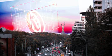 Crypto symbols and the panorama of Kyiv in the background