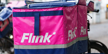 Flink bag with ompany logo visible, fixed on a bike