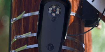 A Flock camera mounted to a pole.