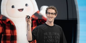 Meta CEO Mark Zuckerberg holding a Muse Charm device