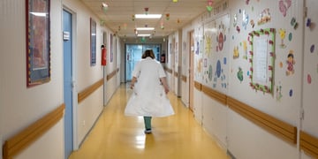 Nurse walking down a hospital corridor