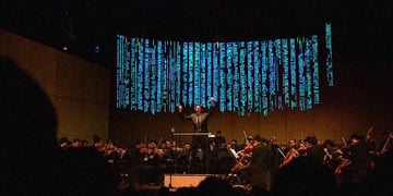 A conductor bringing about software code. Image by Cybernews.