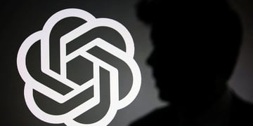 The silhouette of Sam Altman and OpenAI logo