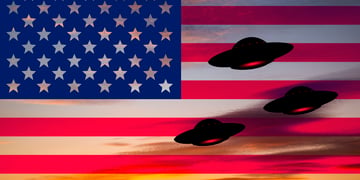 UFOs hovering around the US flag.