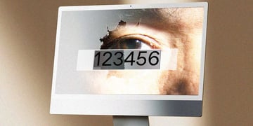 Computer screen with 123456 password typed and eye in the background