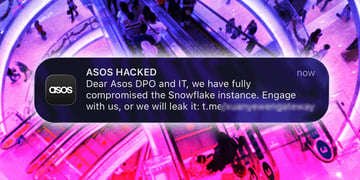 Hacker message to Asos customers via app with a background of people.
