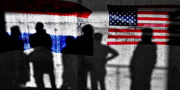Graffitis of the Dutch and the US flags, shadows of people