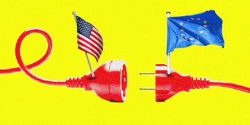 A red plug with the EU flag separated from the socket with the US flag