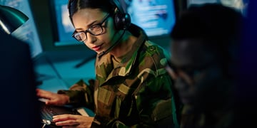 Military control room team, headset and woman with computer and tech for communication