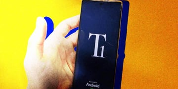 A hand holding Trump Phone