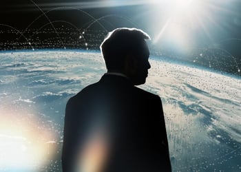 Elon Musk's silhouette over planet Earth.