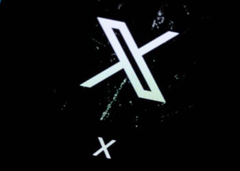 X app logo on phone screen, scratched