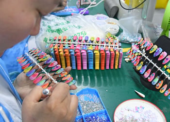 manicure, white chinese woman face, orange, pink, lemon green, yellow plastic nails.