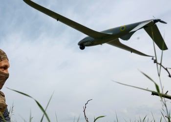 white soldier in field with tall grass, blue sky, white clouds, huge military drone in the sky