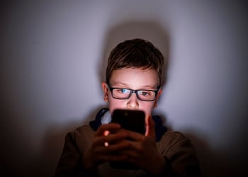 child on phone shadows