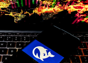 deepseek logo, white whale in blue background, black phone screen, black keyboard, world map