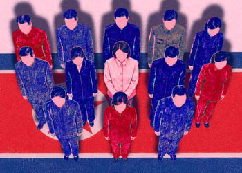 A group of fake North Korean remote workers standing on a North Korean flag