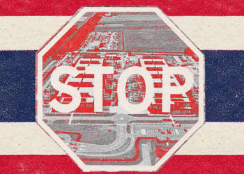 Thai flag with stop sign in the middle