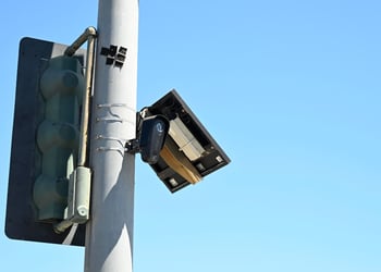 A Flock camera is located at the corner of Harbor Blvd.