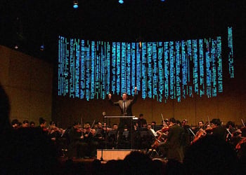 A conductor bringing about software code. Image by Cybernews.