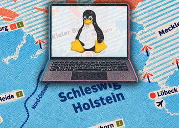 A laptop with Linux logo, a map of Schleswig-Holstein