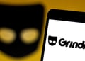 The logo of grindr app on a smartphone screen.