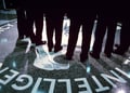 Footsteps and shadows on the CIA logo.