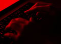 fingers on a laptop keyboard