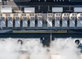 Aerial drone view of a large hyperscale data center cooling system with massive industrial fans